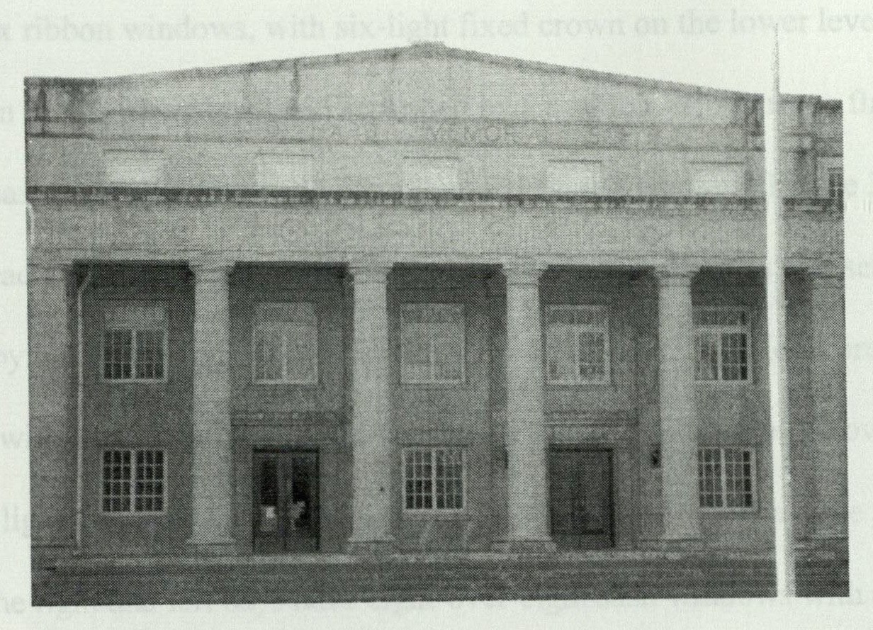 Pedimented parapet above the portico entrance
